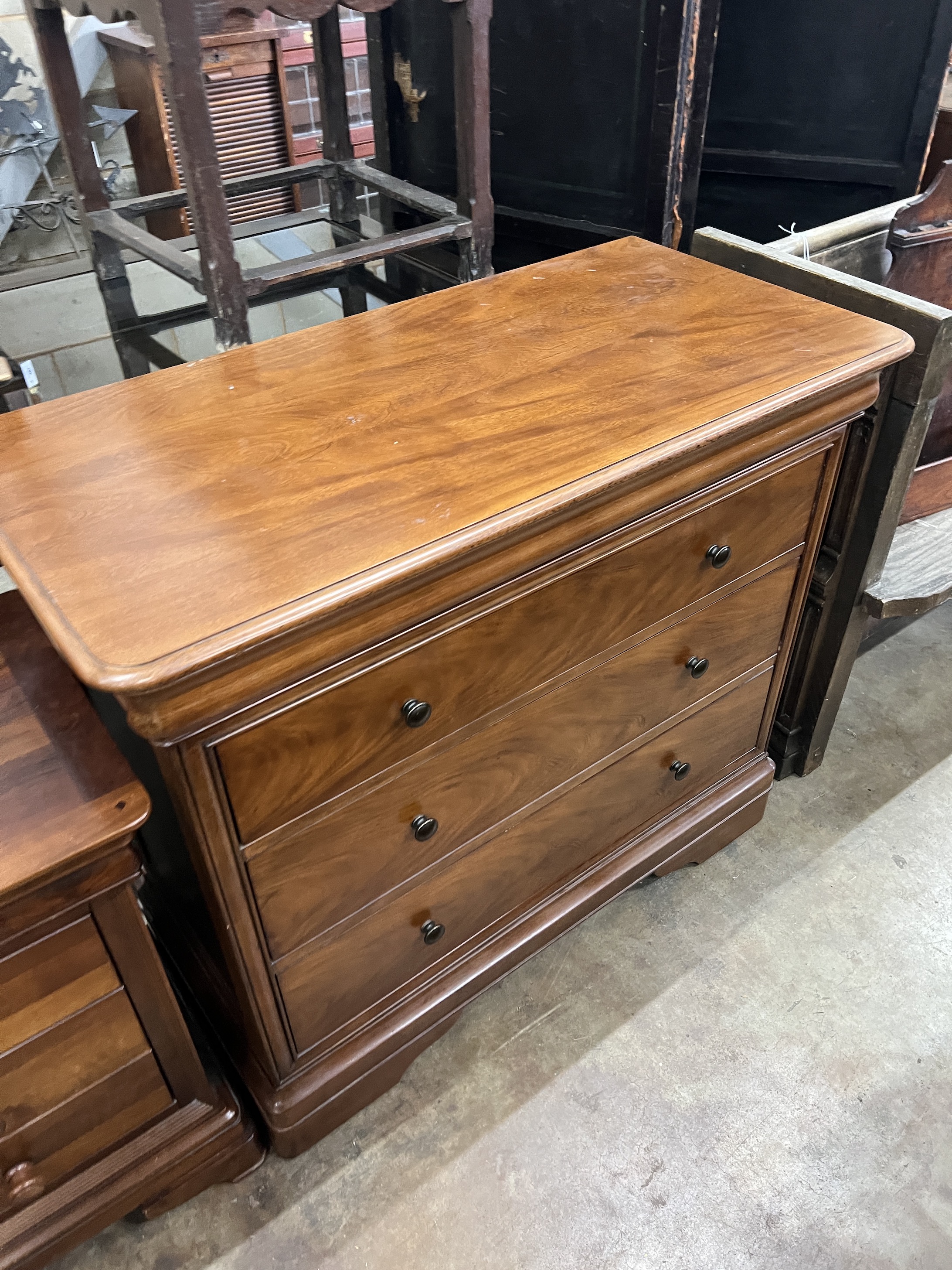 A contemporary five piece French mahogany bedroom suite, comprising sleigh bed, width 190cm, length 220cm, height 102cm (missing some bolts), a six drawer tall chest, three drawer chest and a pair of bedside chests